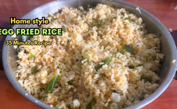 Home-style egg fried rice with cabbage, capsicum, carrot and curry leaves in a kadai